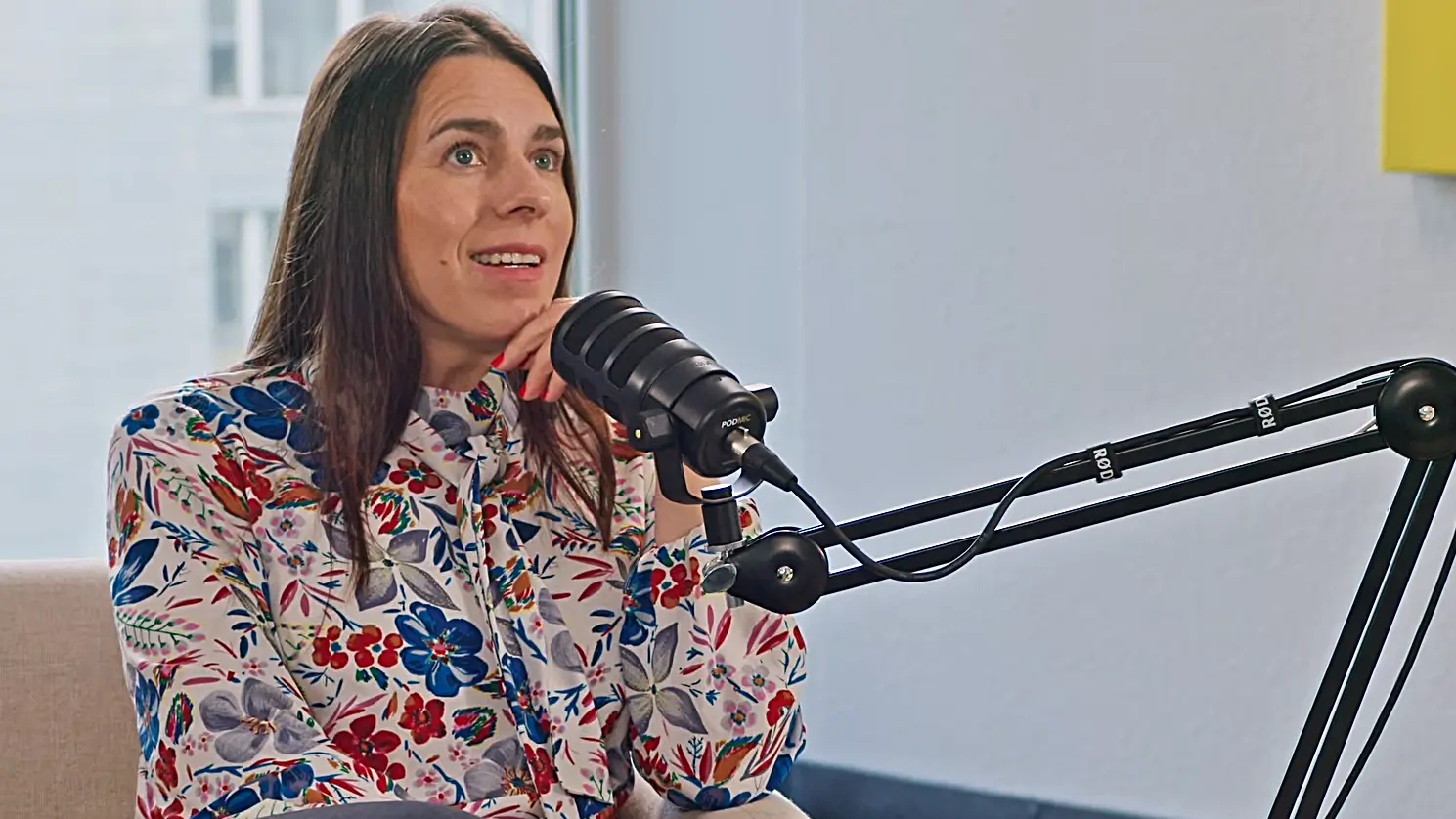 Valentina Kerst speaking into a podcast microphone