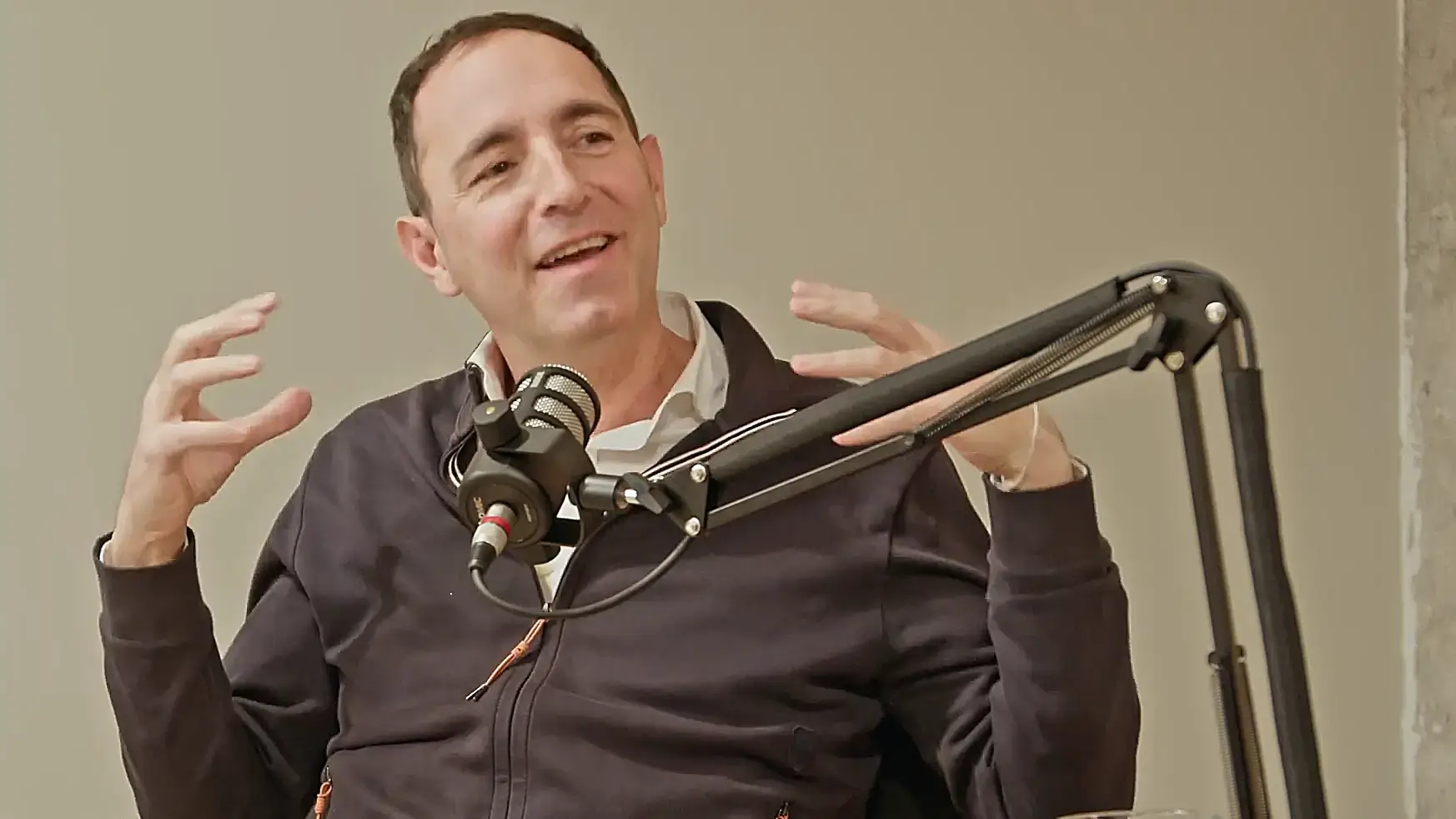 Marius Rossel speaking in a podcast studio