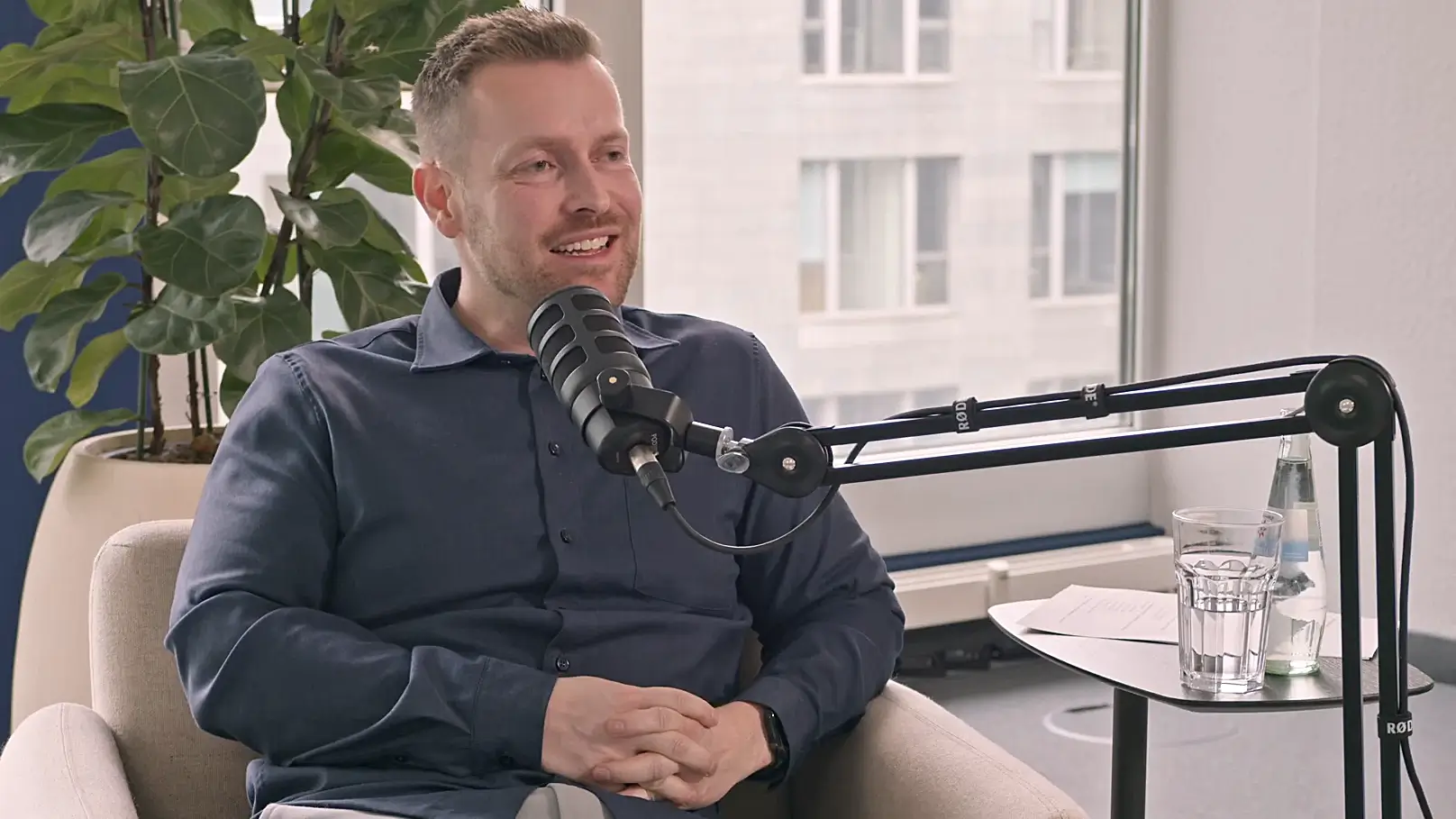 Maurice Grimberg speaking in a podcast studio