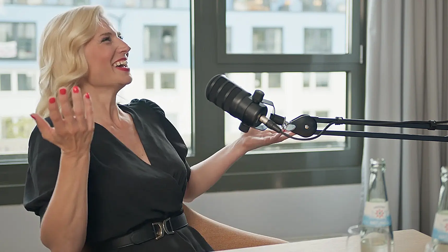 Carolin Handschuh speaking in a podcast studio